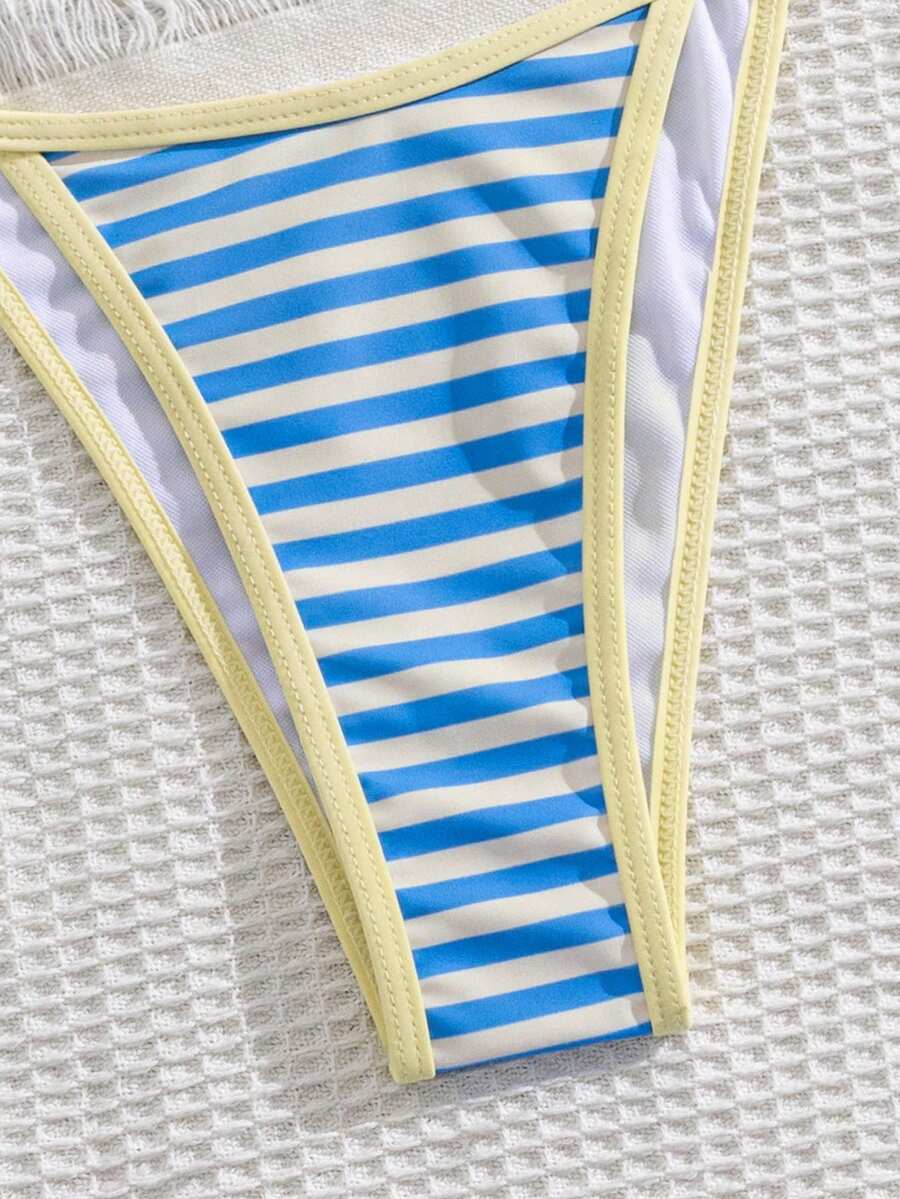 Multicolor bohemian bikini set for women featuring a backless halter top with knot details and high cut swimsuit bottoms.