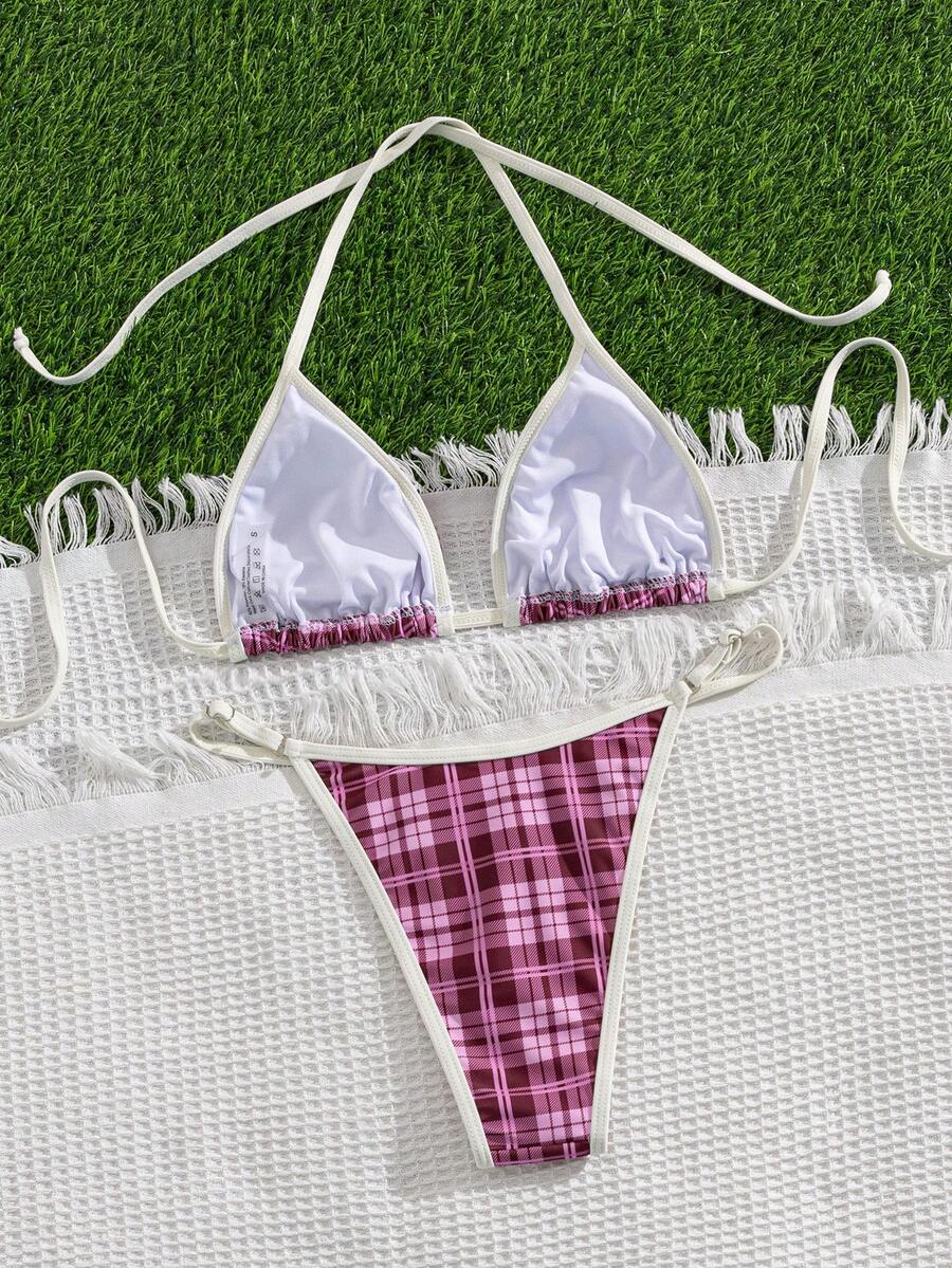 Multicolor bohemian bikini set for women featuring a backless halter top with knot details and high cut swimsuit bottoms.