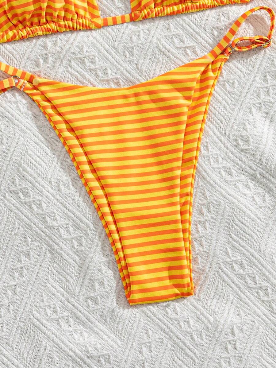 Women's printed halter neck tie two-piece swimwear featuring a wireless triangle top with removable padding and high-waist high-cut bikini bottoms.