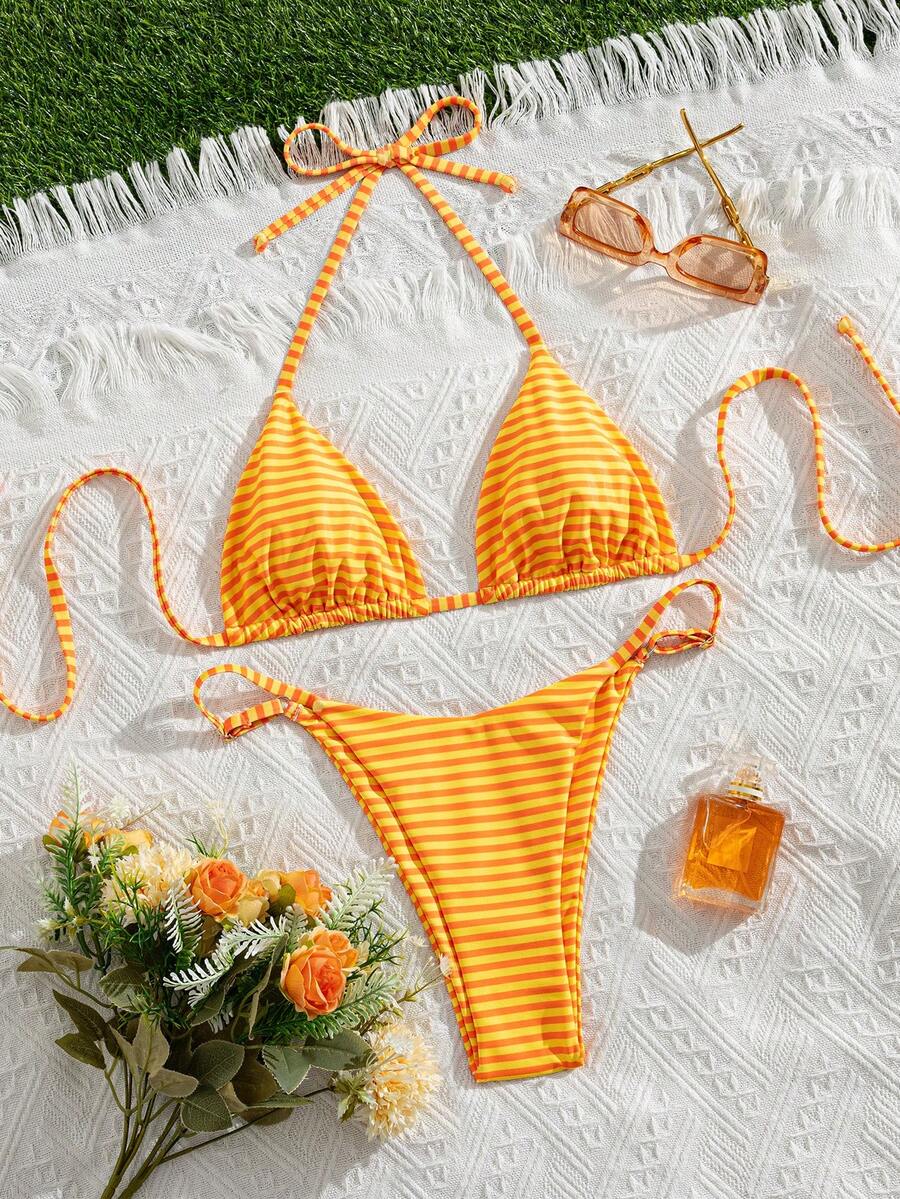 Women's printed halter neck tie two-piece swimwear featuring a wireless triangle top with removable padding and high-waist high-cut bikini bottoms.