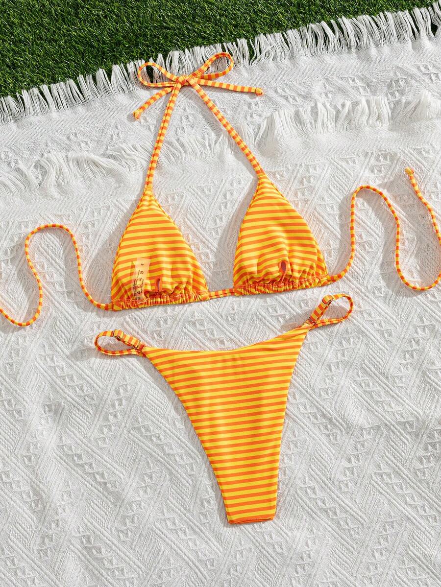 Women's printed halter neck tie two-piece swimwear featuring a wireless triangle top with removable padding and high-waist high-cut bikini bottoms.