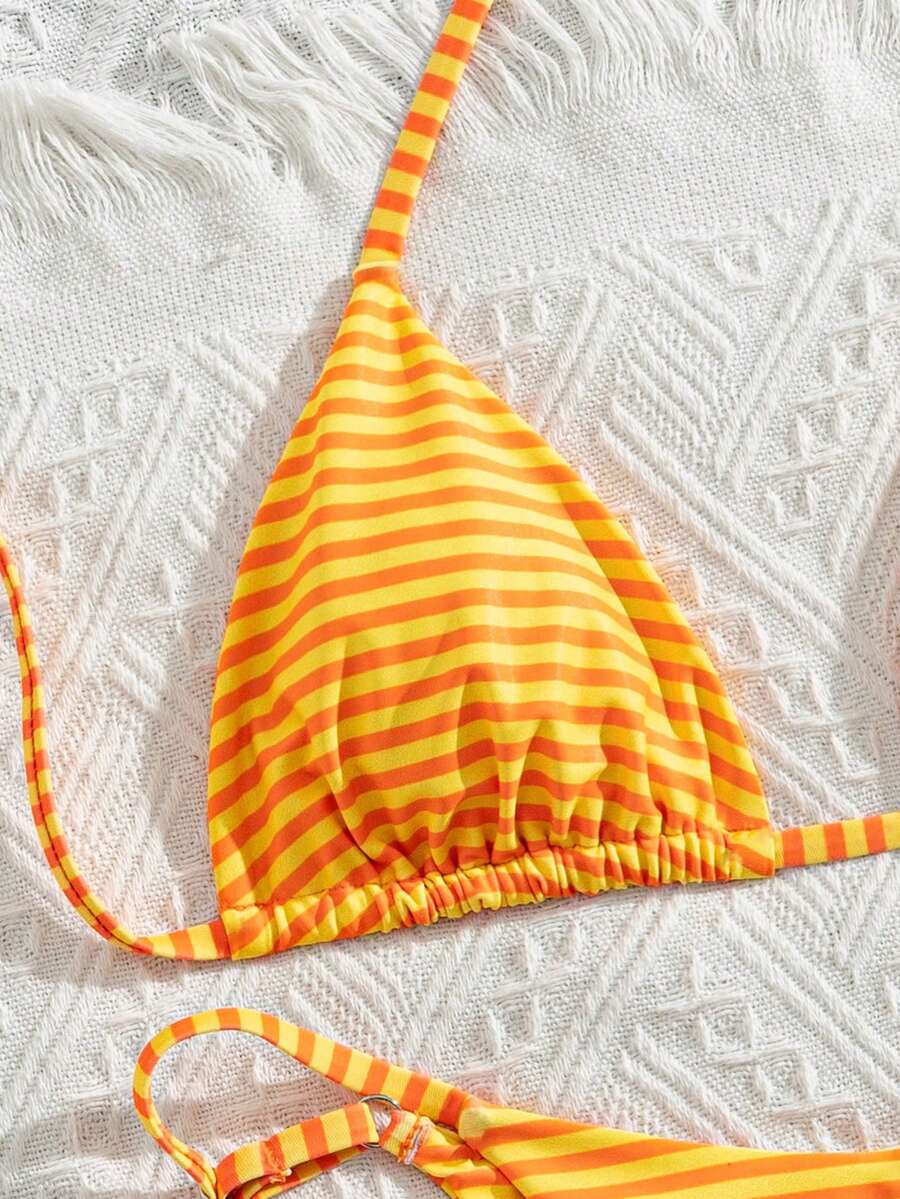 Women's printed halter neck tie two-piece swimwear featuring a wireless triangle top with removable padding and high-waist high-cut bikini bottoms.