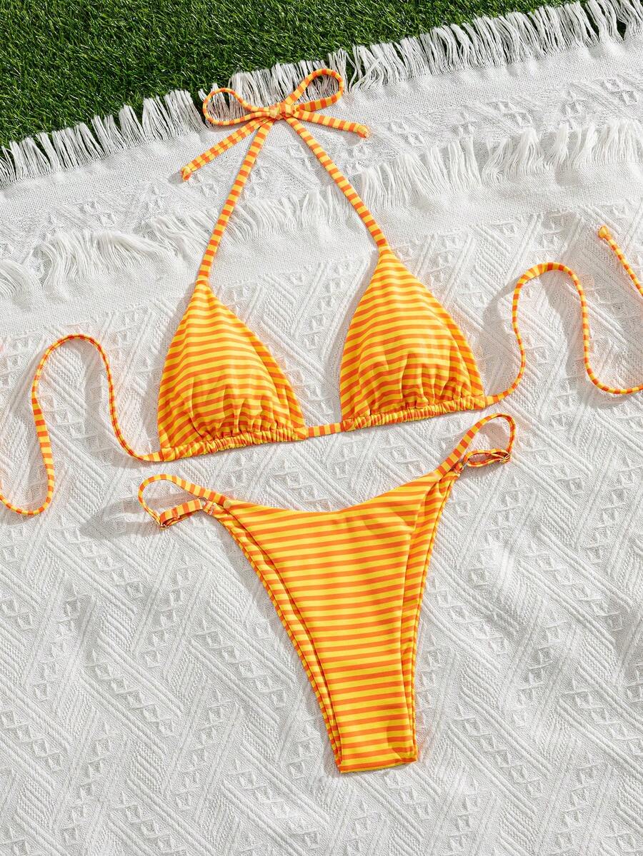 Women's printed halter neck tie two-piece swimwear featuring a wireless triangle top with removable padding and high-waist high-cut bikini bottoms.