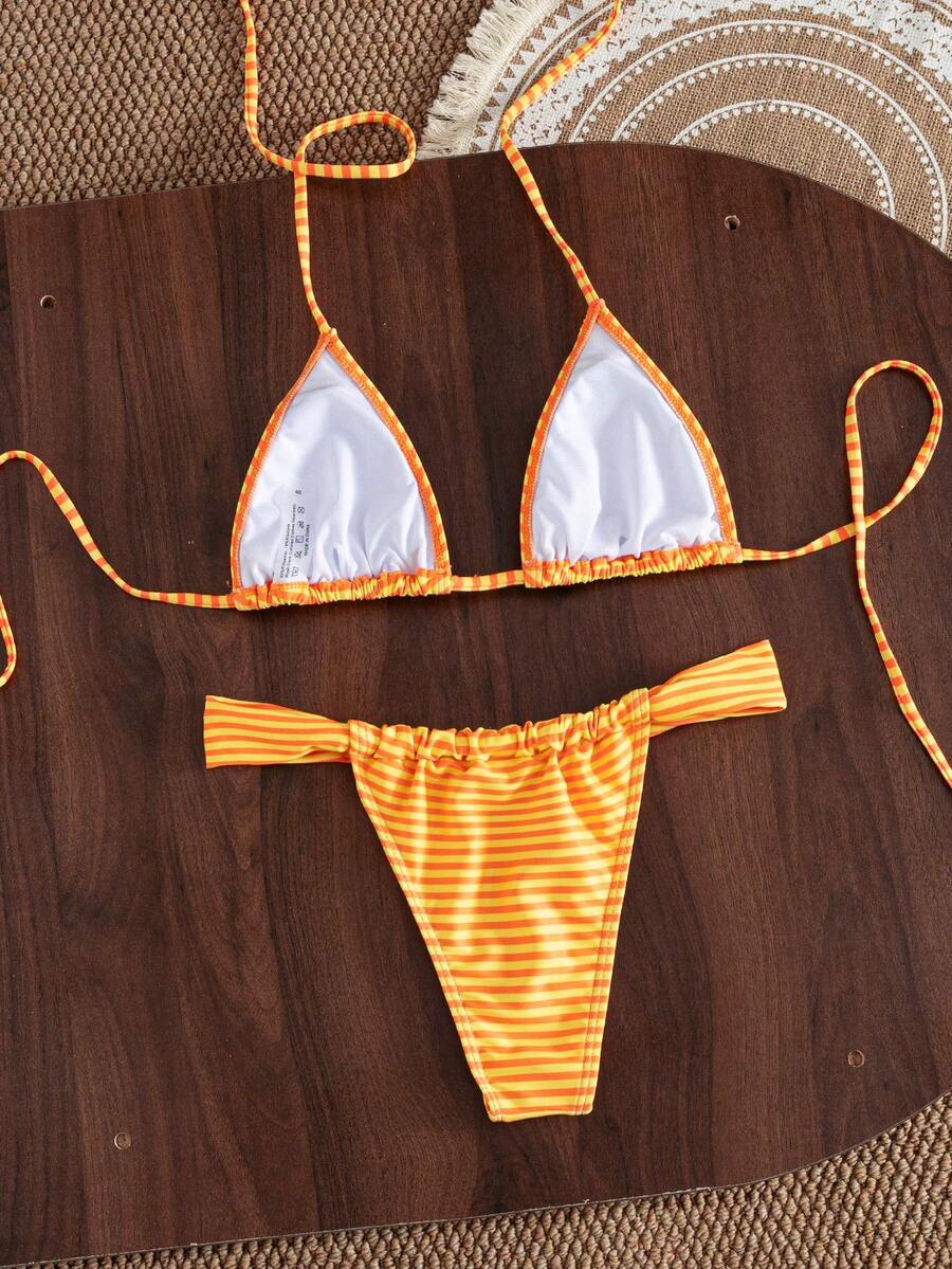 Women's striped halter two-piece swimsuit featuring a lace-up triangle top with removable padding and high-cut low-waist bikini bottoms.