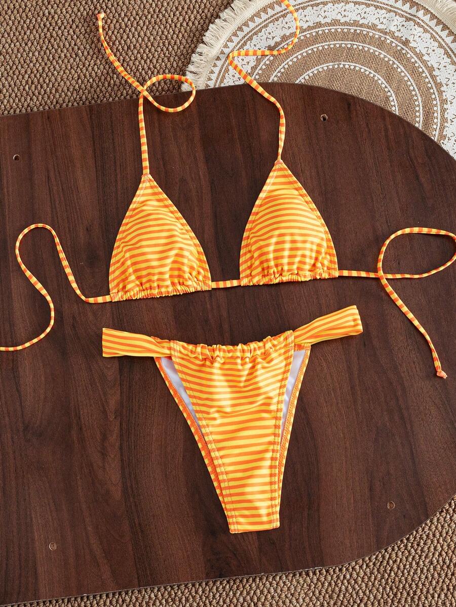 Women's striped halter two-piece swimsuit featuring a lace-up triangle top with removable padding and high-cut low-waist bikini bottoms.