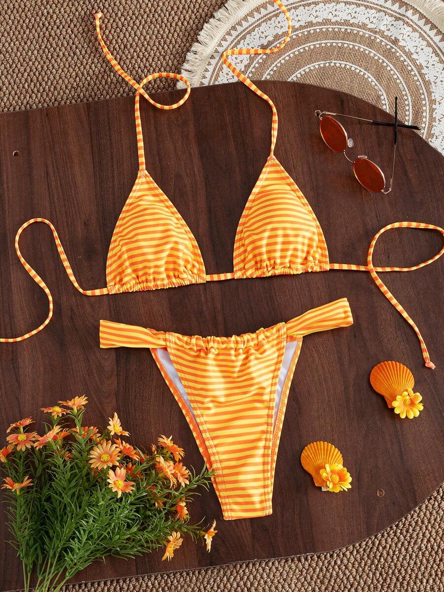 Women's striped halter two-piece swimsuit featuring a lace-up triangle top with removable padding and high-cut low-waist bikini bottoms.