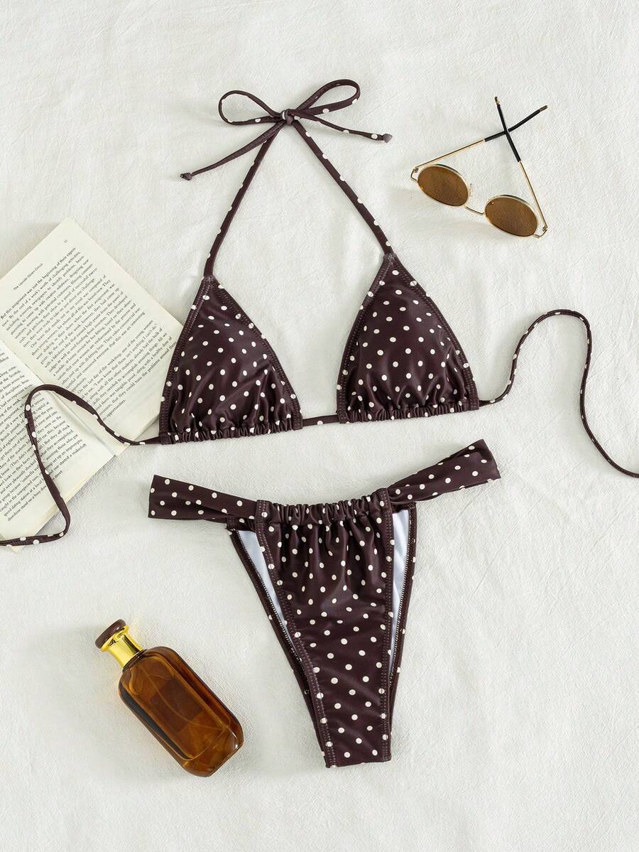 Women's striped halter two-piece swimsuit featuring a lace-up triangle top with removable padding and high-cut low-waist bikini bottoms.