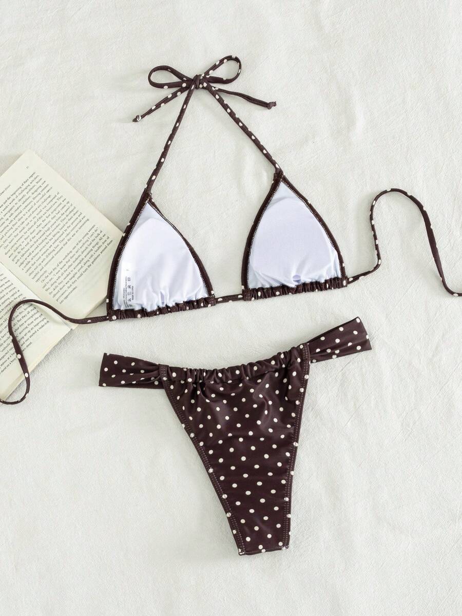 Women's striped halter two-piece swimsuit featuring a lace-up triangle top with removable padding and high-cut low-waist bikini bottoms.