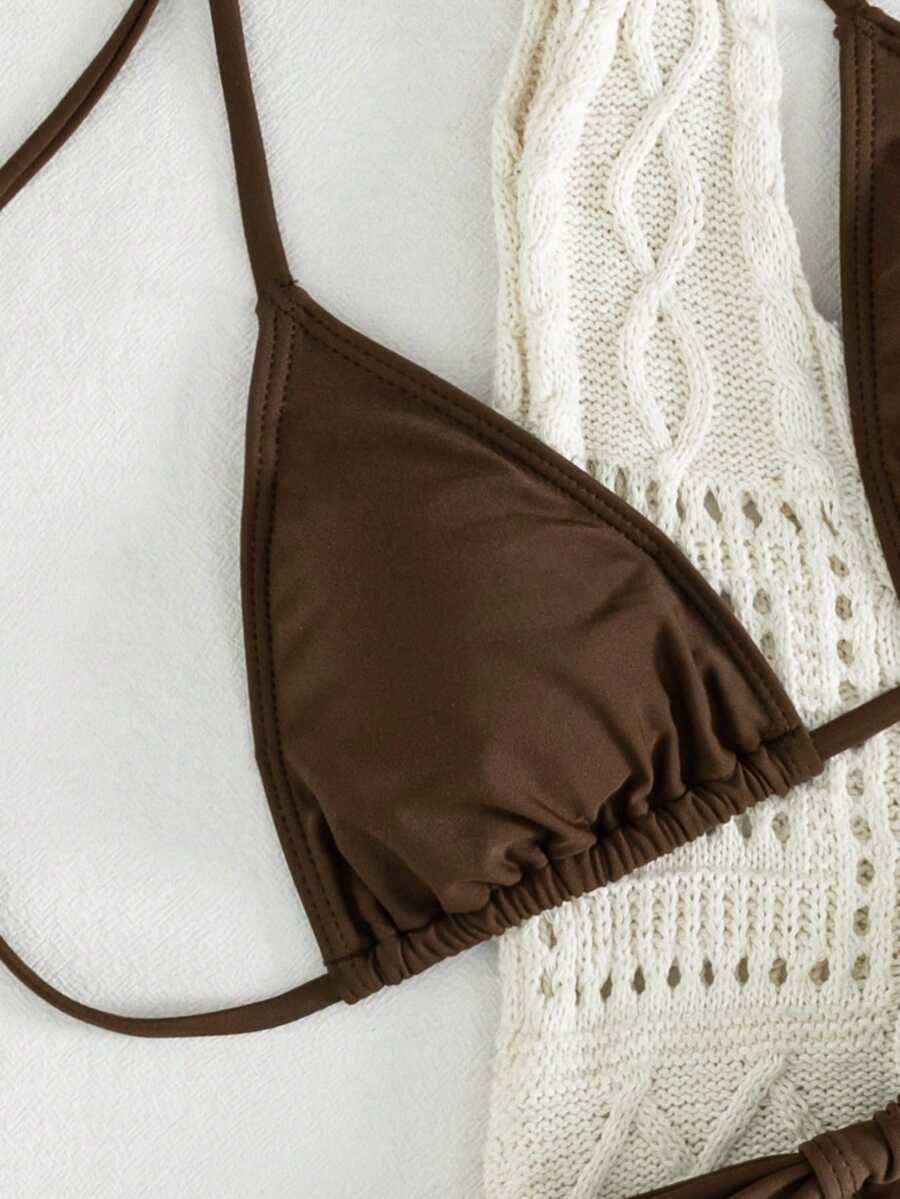 Women's striped halter two-piece swimsuit featuring a lace-up triangle top with removable padding and high-cut low-waist bikini bottoms.