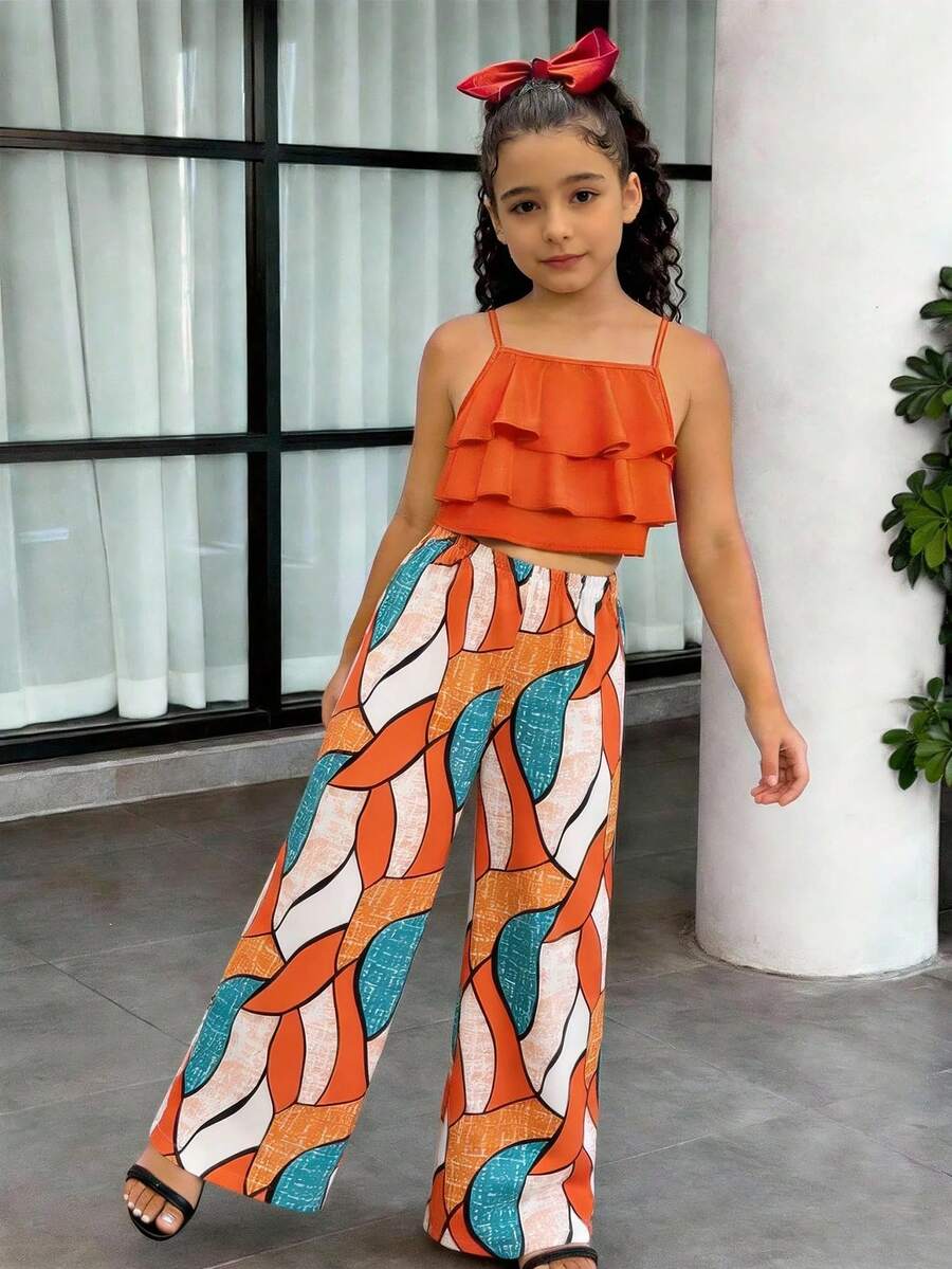 Tween girls blue 2-piece vacation outfit set featuring a tiered ruffle spaghetti strap camisole and loose high-waist pants.