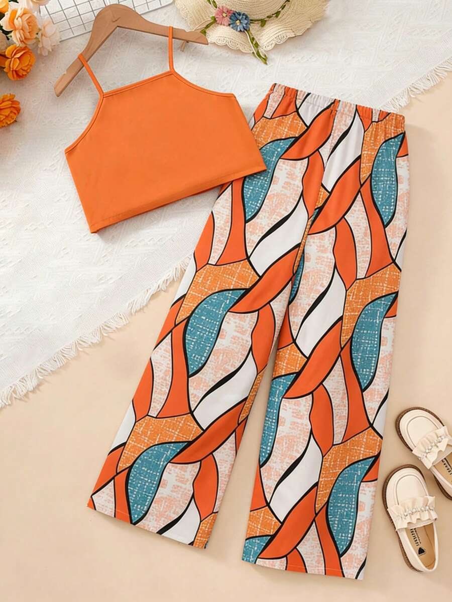 Tween girls blue 2-piece vacation outfit set featuring a tiered ruffle spaghetti strap camisole and loose high-waist pants.