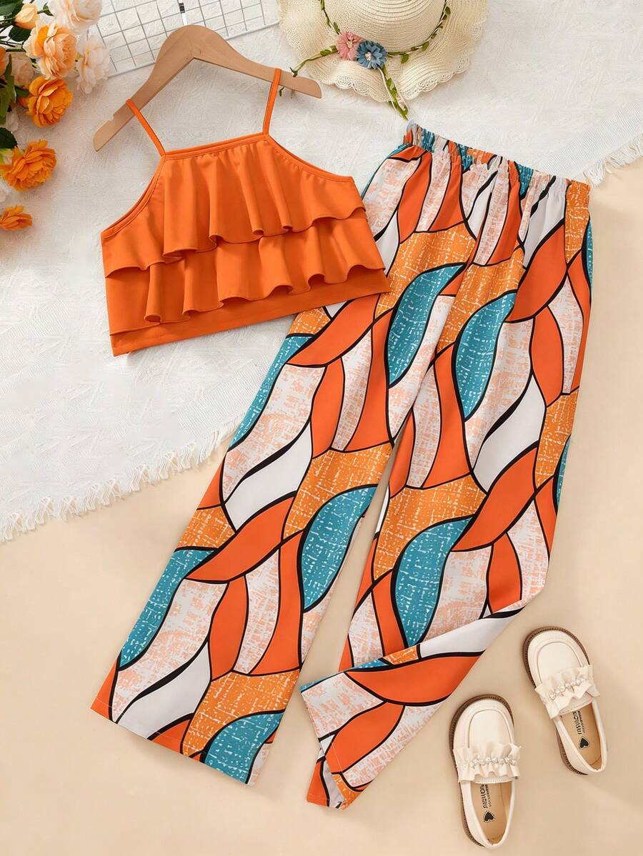 Tween girls blue 2-piece vacation outfit set featuring a tiered ruffle spaghetti strap camisole and loose high-waist pants.