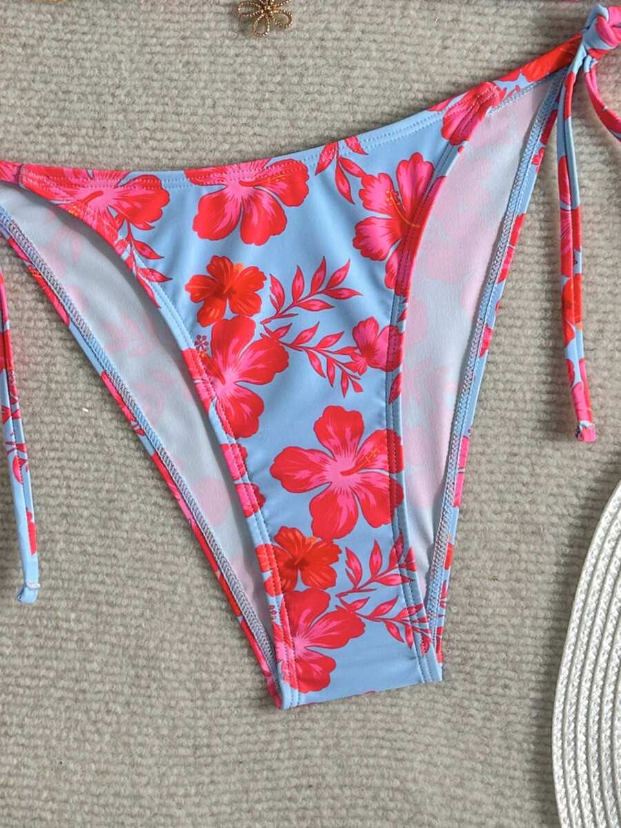 Women's black two-piece bikini set featuring a halter neck with a colorful sun pendant, triangle cups, and high-cut tie-side bottoms.