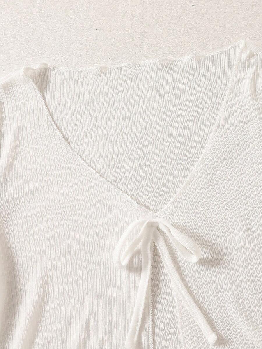 Tween girls white long sleeve V-neck cardigan top featuring asymmetrical front buttons.