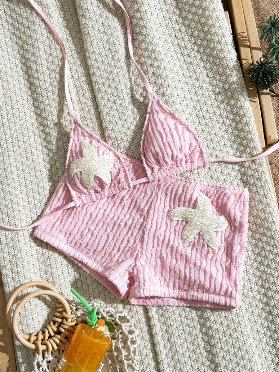 Women's apricot two-piece swimsuit set with a halter tie-back top and matching high stretch shorts.