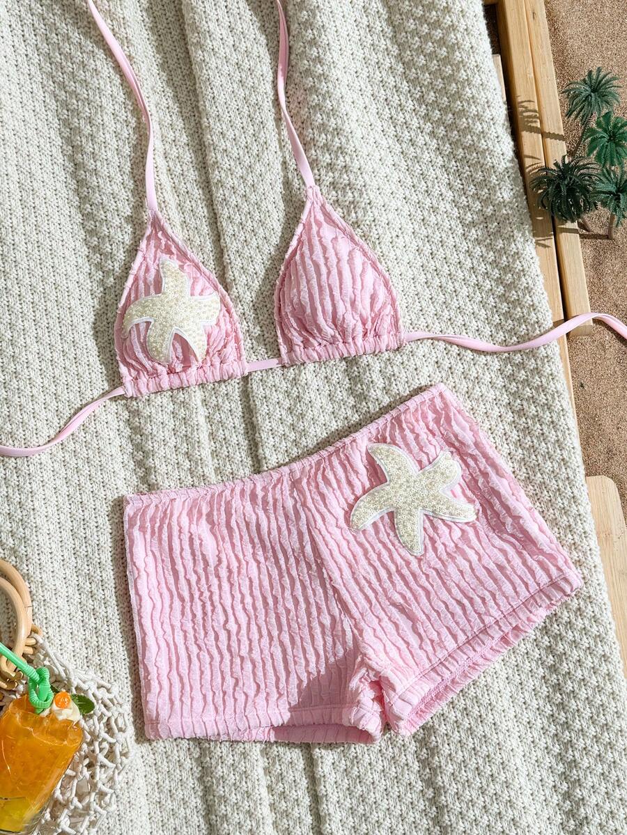 Women's apricot two-piece swimsuit set with a halter tie-back top and matching high stretch shorts.