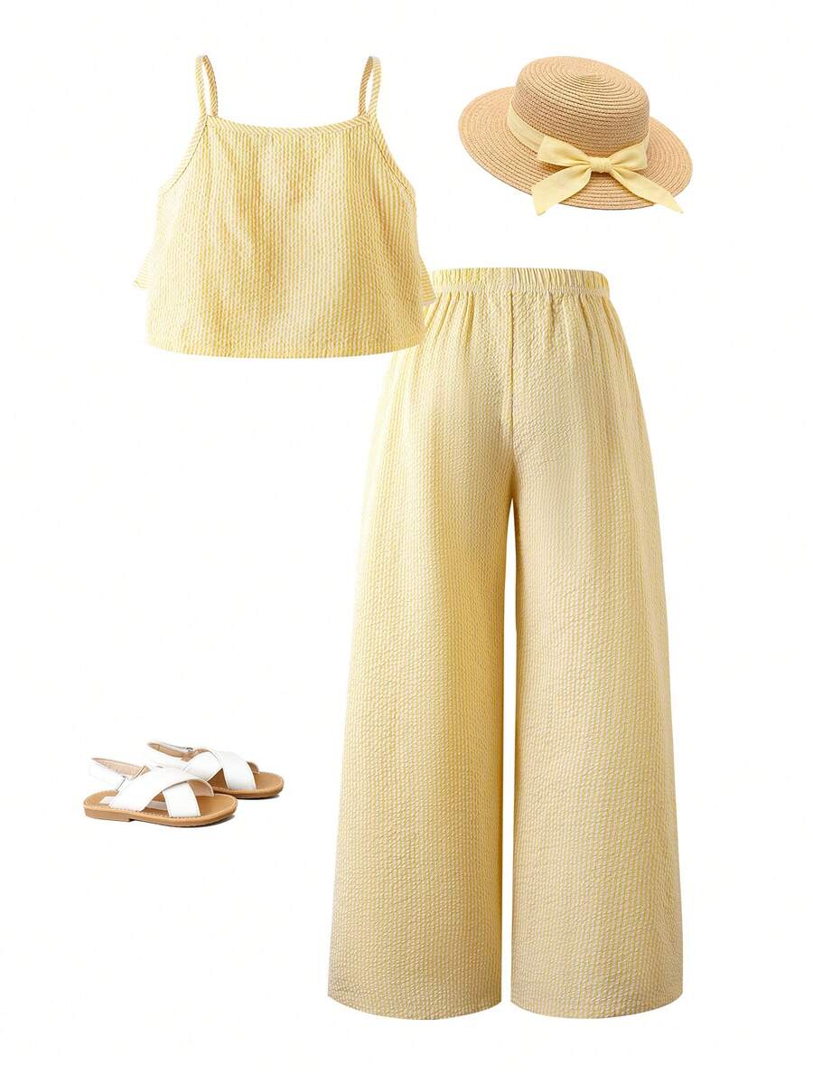 Tween girls blue 2-piece vacation outfit set featuring a tiered ruffle spaghetti strap camisole and loose high-waist pants.