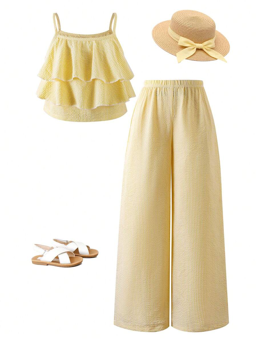 Tween girls blue 2-piece vacation outfit set featuring a tiered ruffle spaghetti strap camisole and loose high-waist pants.
