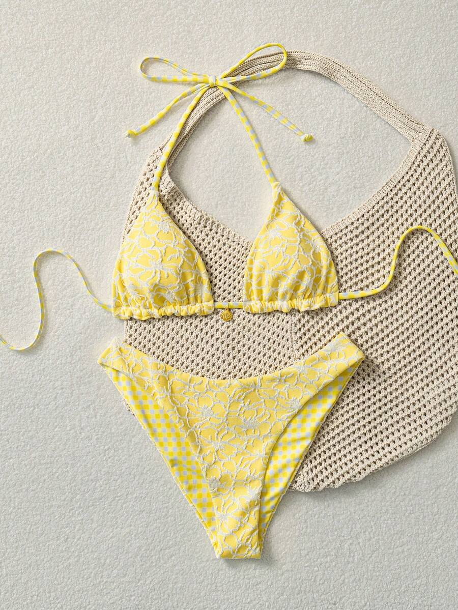 Women's black textured plaid 2-piece bikini set featuring a halter neckline, wireless triangle cups with removable padding, and mid-waist bottoms.