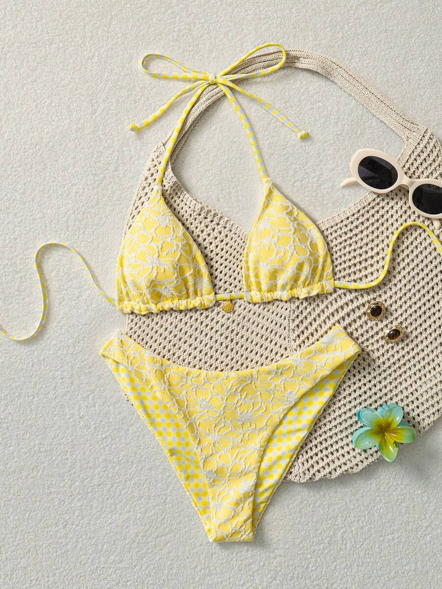 Women's black textured plaid 2-piece bikini set featuring a halter neckline, wireless triangle cups with removable padding, and mid-waist bottoms.