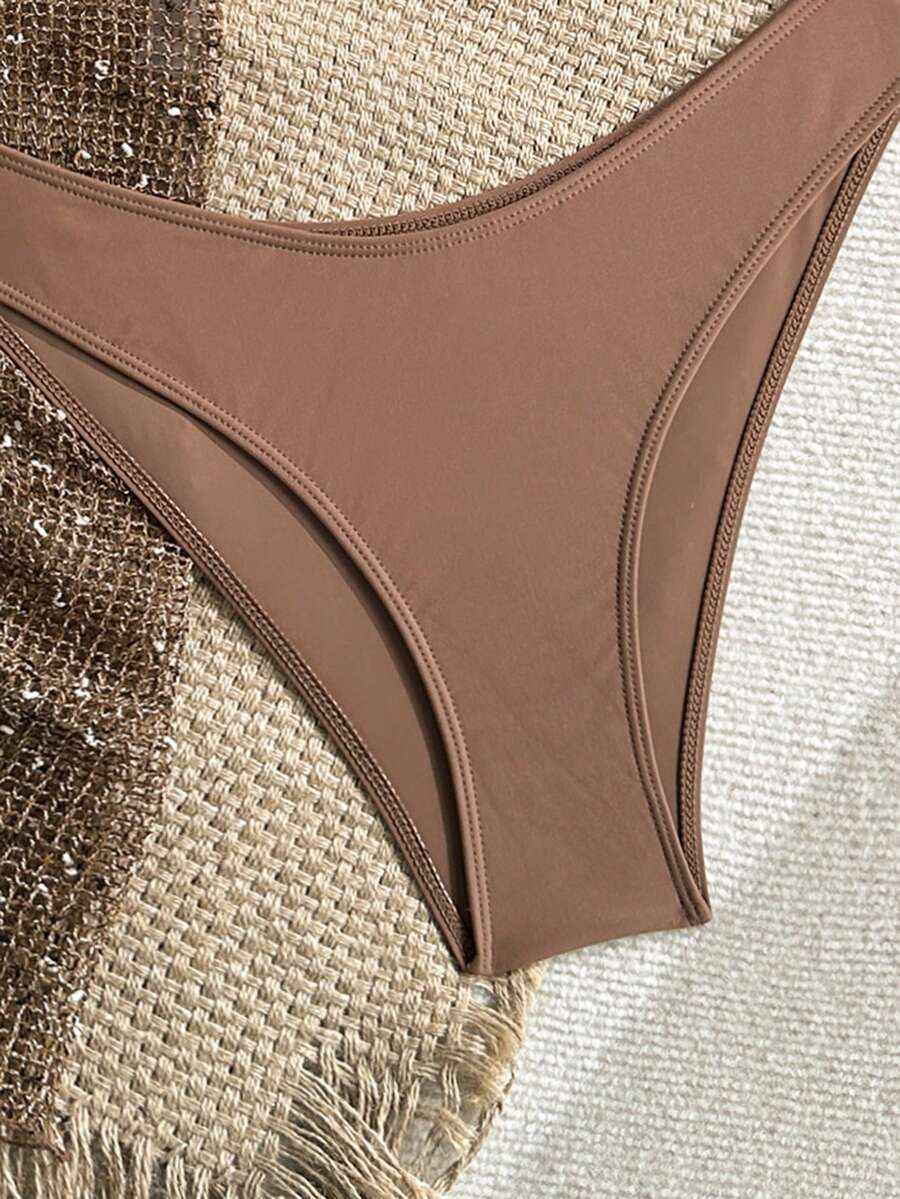 Women's 3-piece net fabric swimsuit set featuring a plain triangle bikini top with spaghetti straps, high-waisted high-cut bottoms, and a matching skirt with knot detail.