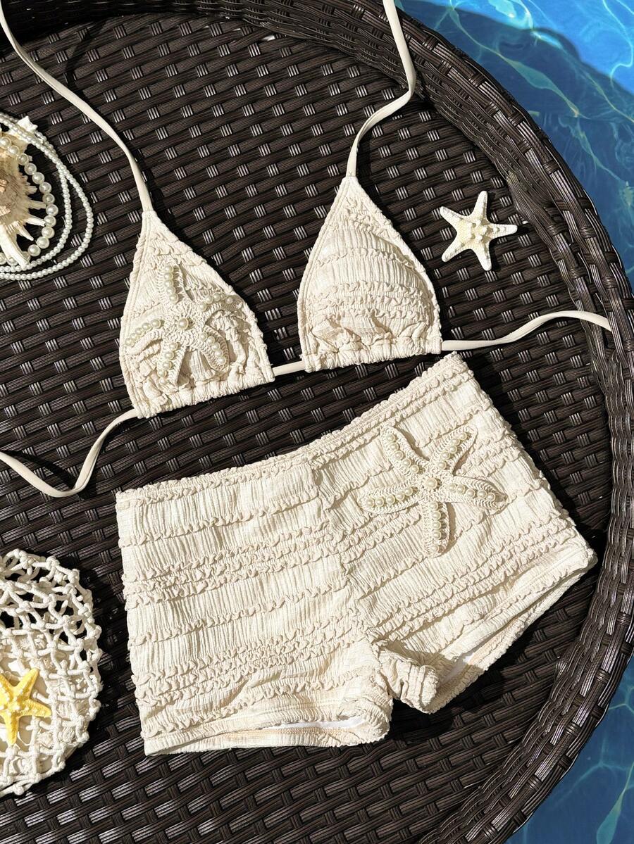 Women's apricot two-piece swimsuit set with a halter tie-back top and matching high stretch shorts.