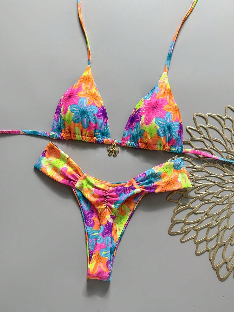 Women's 2-piece triangle cup bikini set in solid color featuring woven pearl shell decoration, halter neckline, and high-waist side-tie ruched bottoms.