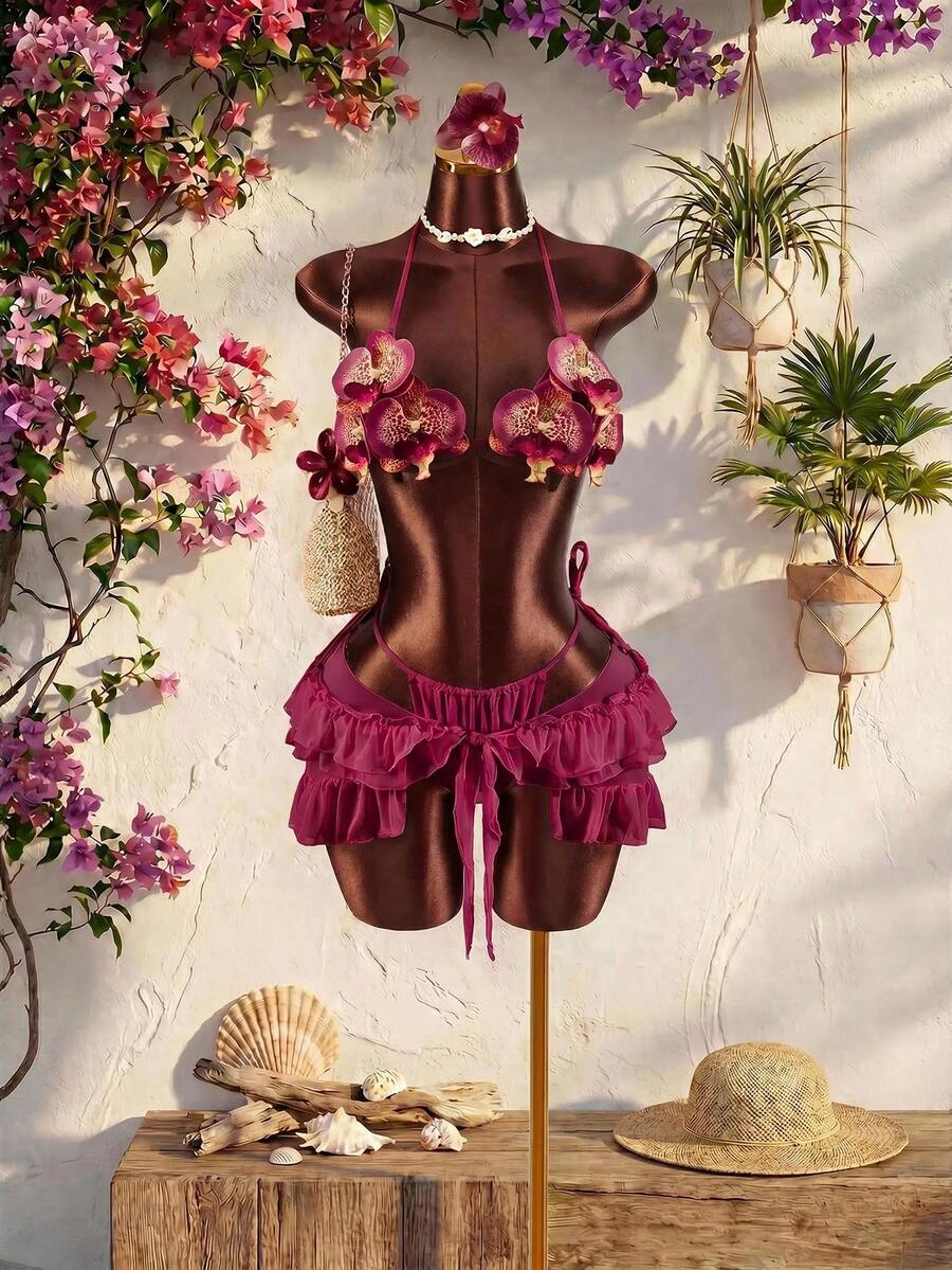 Women's 3-piece blue bikini swimwear set featuring a crop top with 3D rose accents, tie back detail, spaghetti straps, and tie-side bottoms.