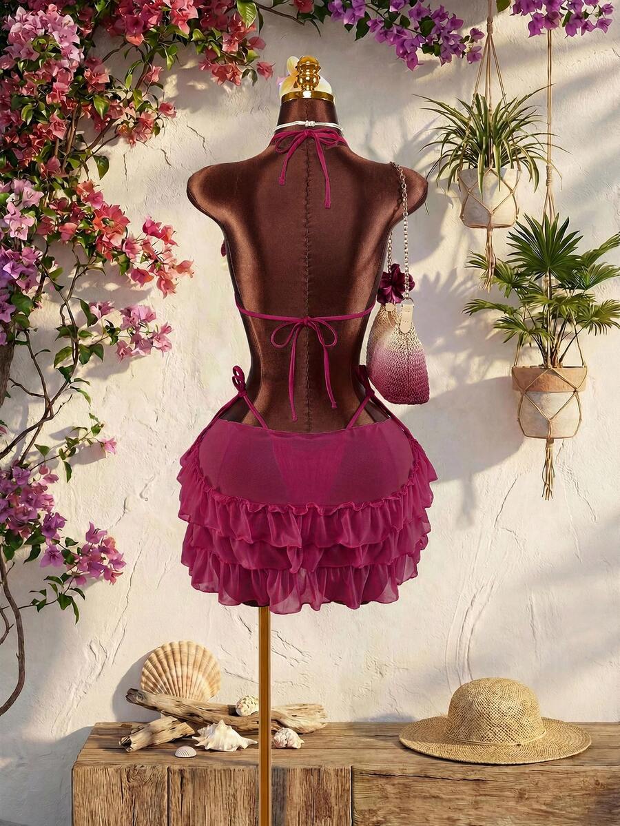 Women's 3-piece blue bikini swimwear set featuring a crop top with 3D rose accents, tie back detail, spaghetti straps, and tie-side bottoms.