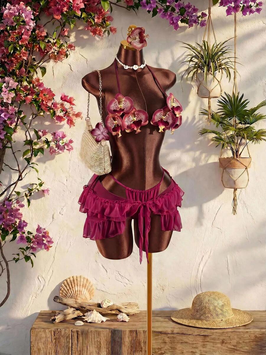 Women's 3-piece blue bikini swimwear set featuring a crop top with 3D rose accents, tie back detail, spaghetti straps, and tie-side bottoms.