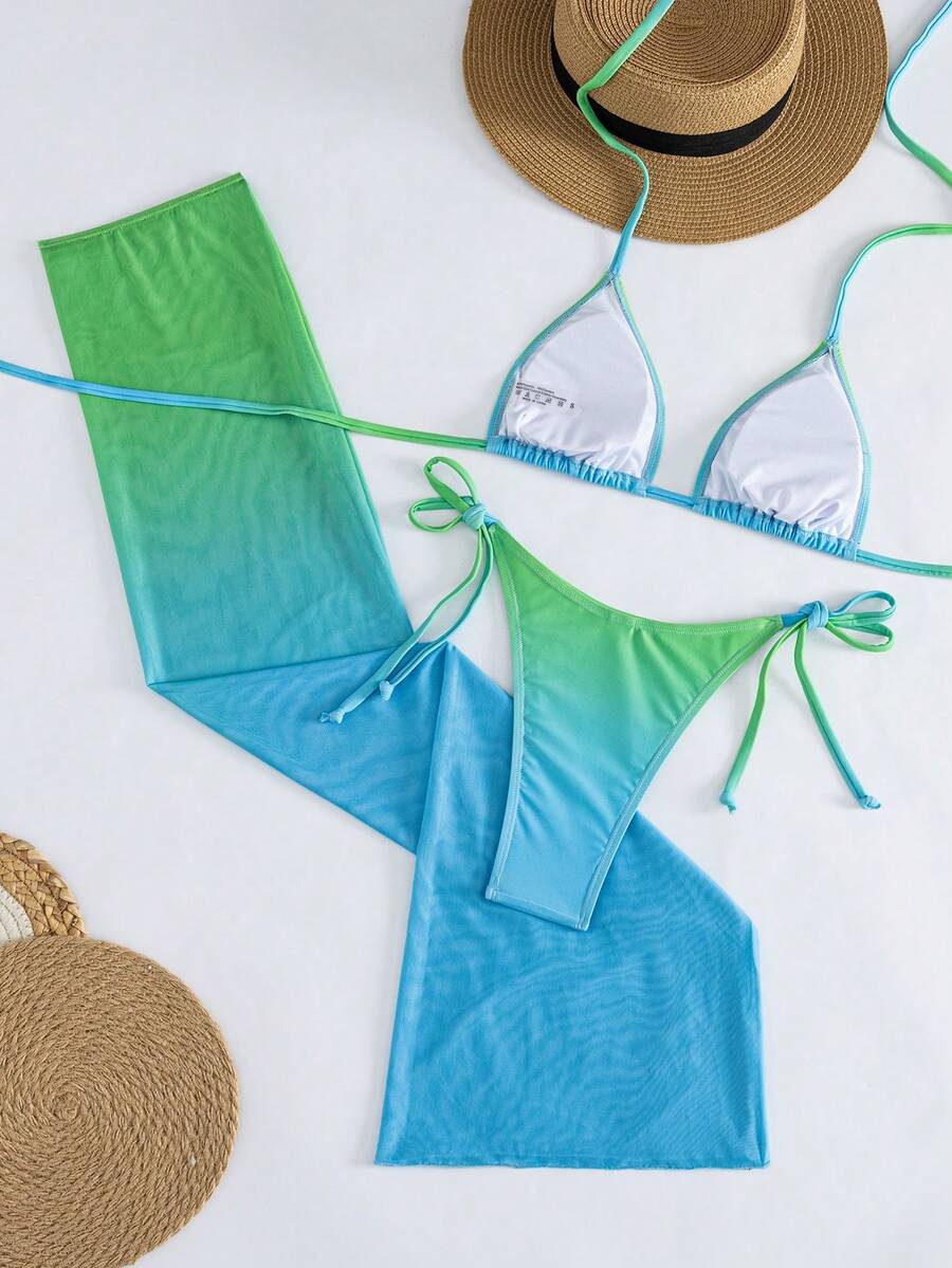 Women's 3-piece gradient bikini set featuring a green halter tie top with removable padding, low waist bottoms, and a matching sheer mesh skirt.