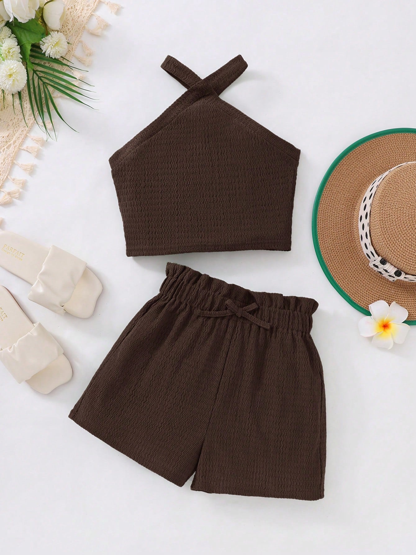 Tween girl 2-piece casual outfit set featuring a solid beige knit halter sleeveless top with belted detail and matching shorts.