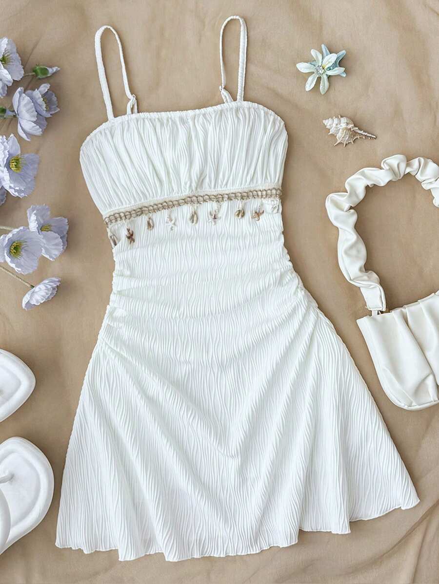 Apricot tween girls sleeveless halter cami dress with appliques, bow front, zipper detail, high waist, flared hem, and short slim fit design.