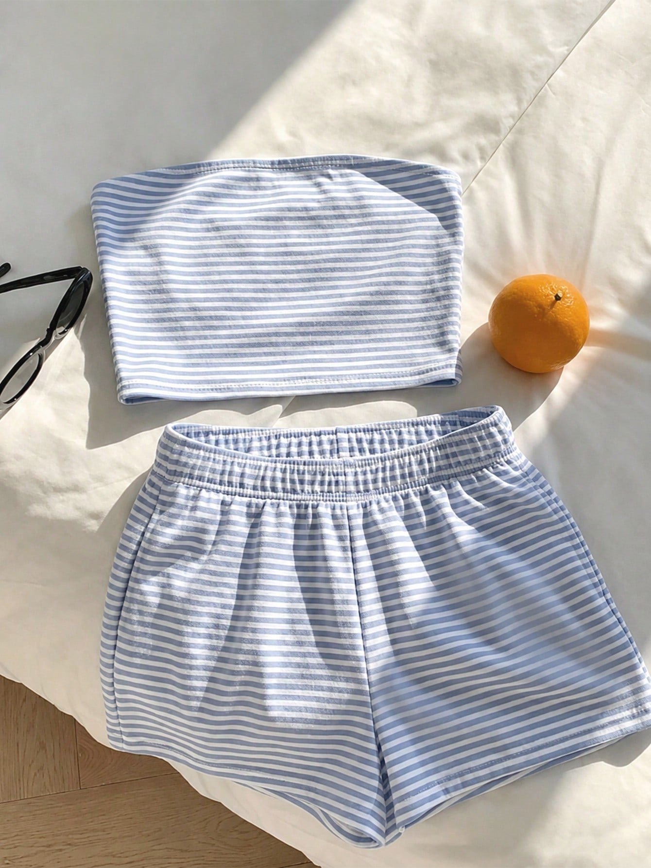 Tween girls two-piece summer outfit featuring a brown strapless tube top with contrast pink tape accent and matching brown shorts with pockets.