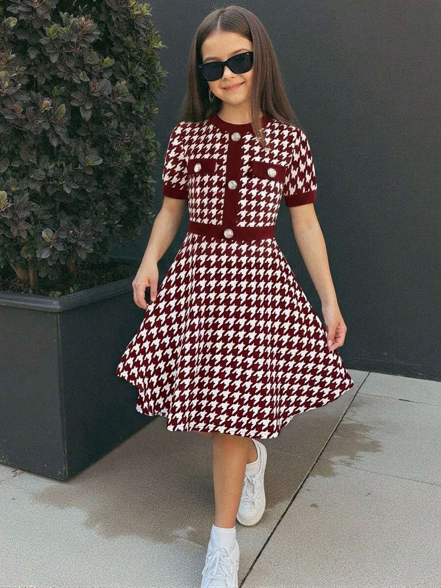 Nova Glow tween girls black and white houndstooth print short sleeve A-line dress with decorative buttons and crew neckline.