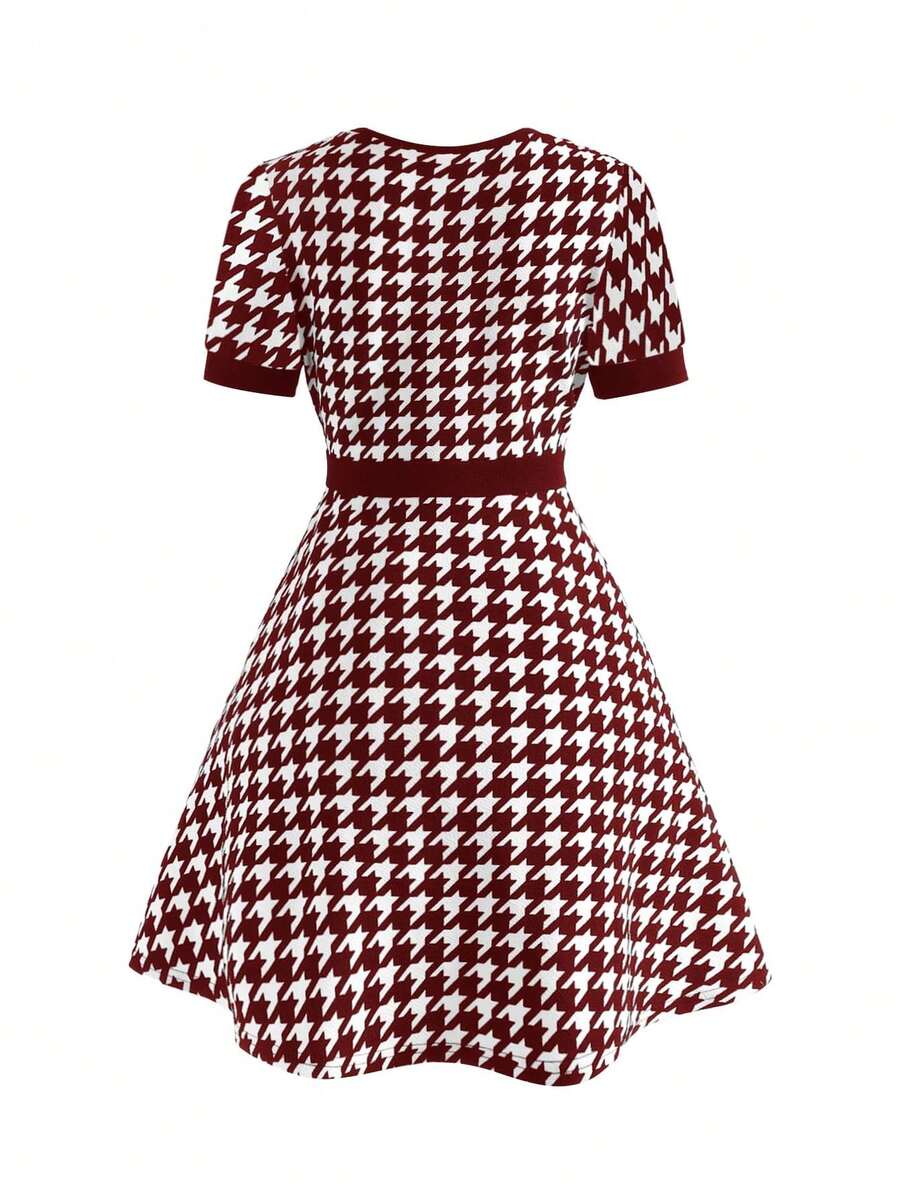 Nova Glow tween girls black and white houndstooth print short sleeve A-line dress with decorative buttons and crew neckline.