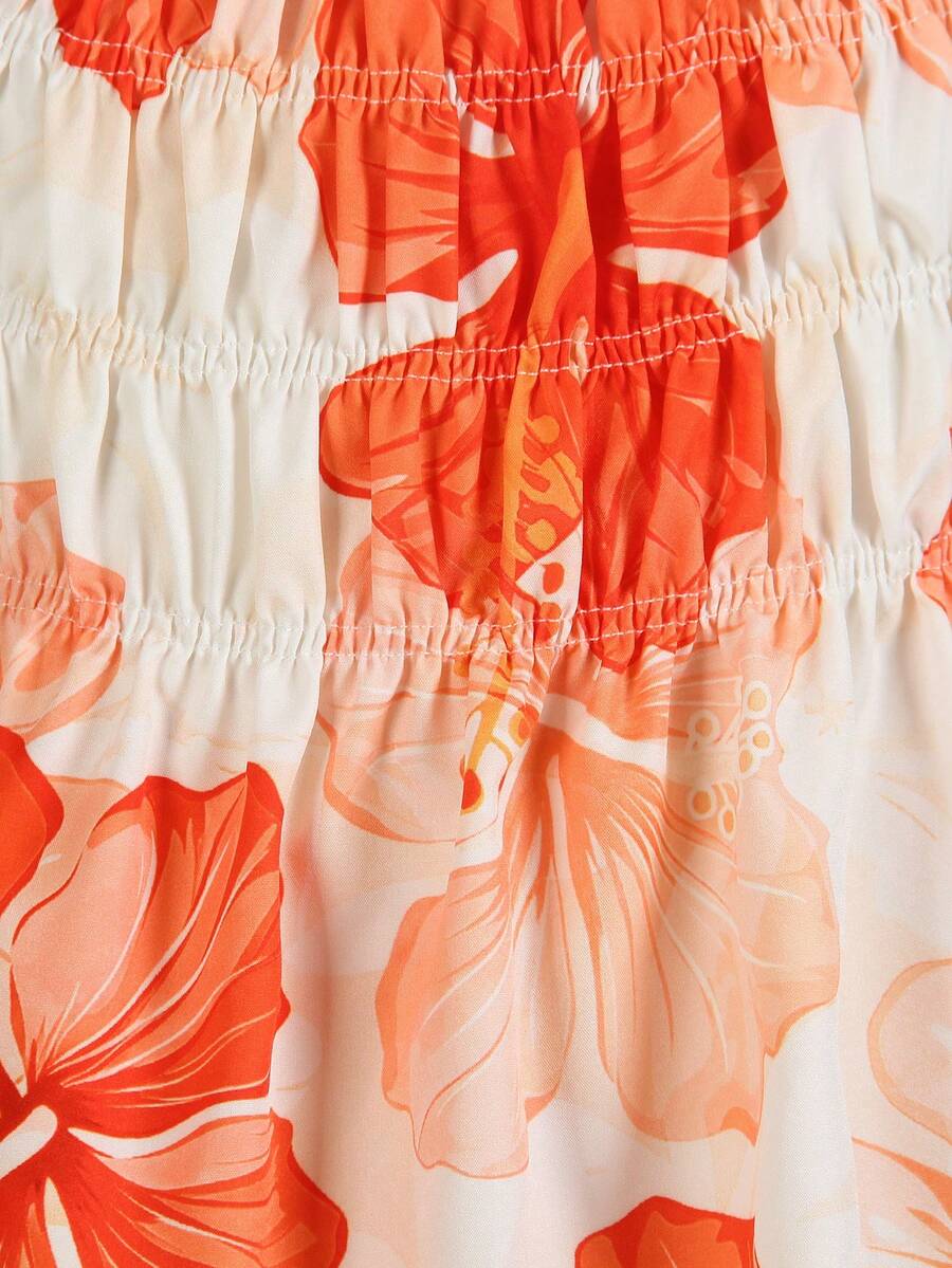 Tween girl wearing an apricot 2-piece outfit set featuring a shirred spaghetti strap short cami top and matching wide-leg long pants.