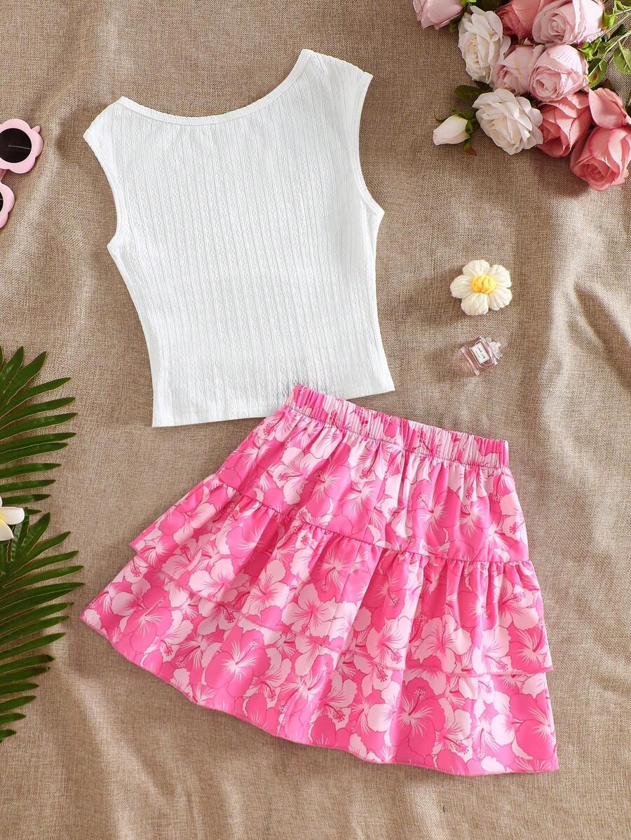 Light blue two-piece outfit set for tween girls with a sleeveless round neck vest top and a tiered ruffle cake skirt featuring a plant pattern.