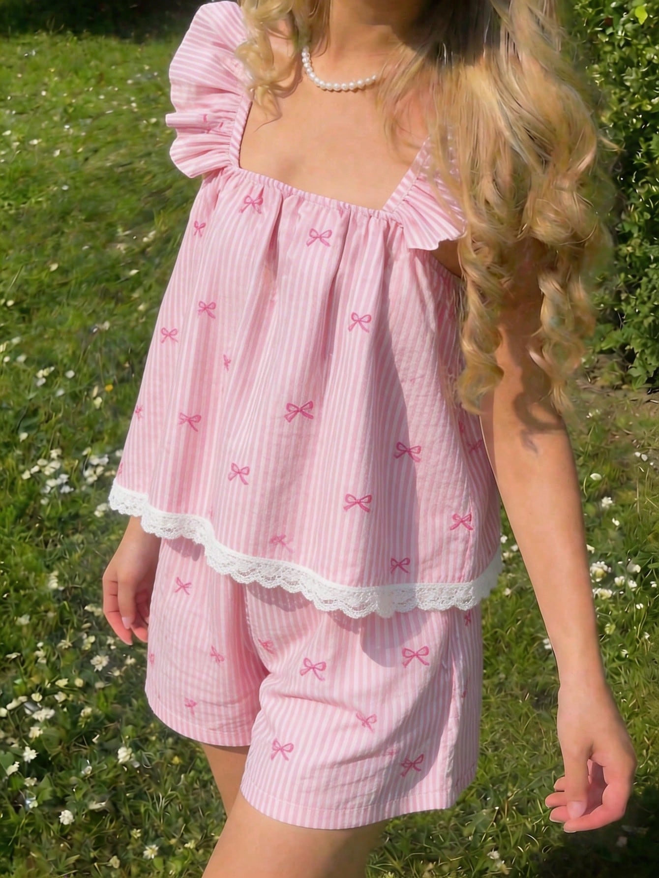 Tween girls 2-piece bohemian outfit set in apricot featuring a square neck embroidered sleeveless camisole top and matching floral wide leg shorts.