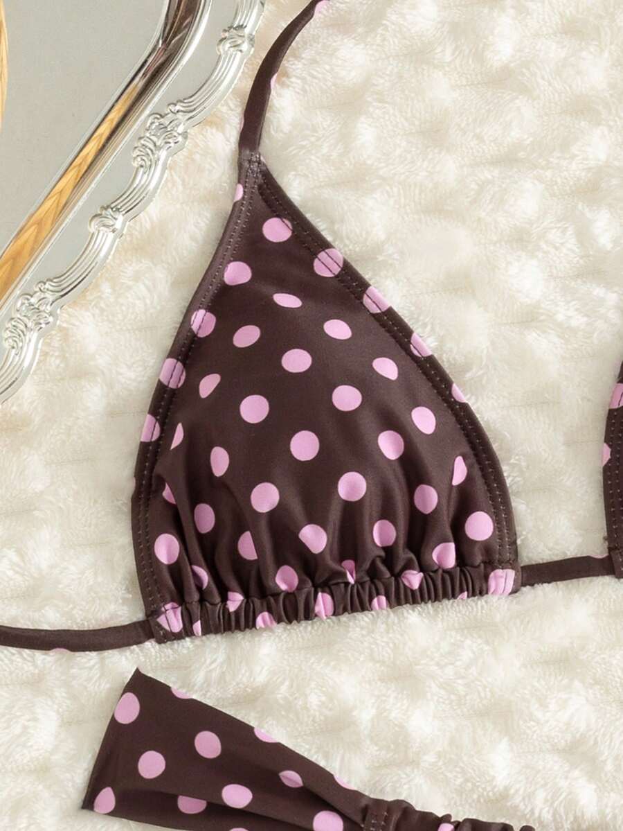 Women's striped halter two-piece swimsuit featuring a lace-up triangle top with removable padding and high-cut low-waist bikini bottoms.
