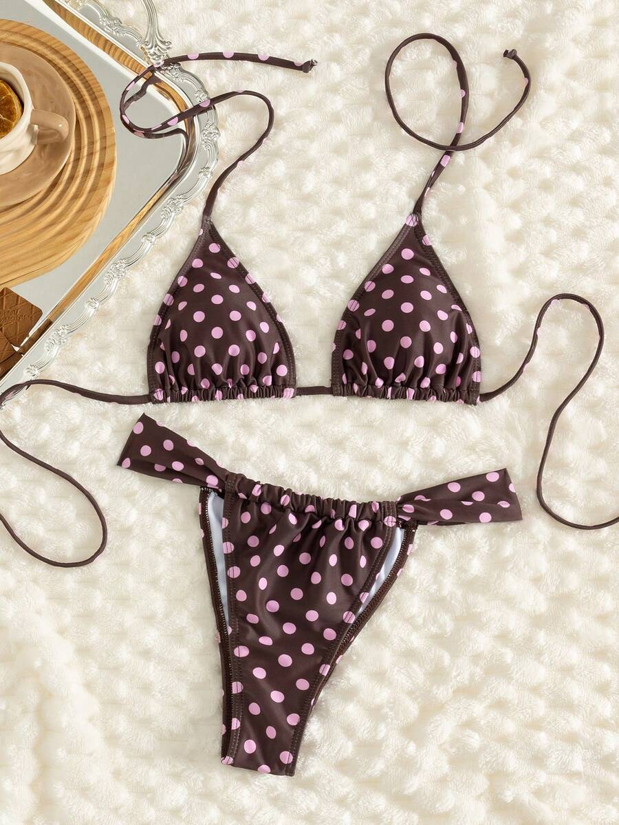 Women's striped halter two-piece swimsuit featuring a lace-up triangle top with removable padding and high-cut low-waist bikini bottoms.