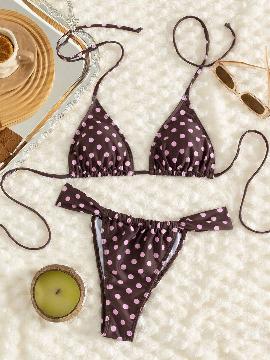 Women's striped halter two-piece swimsuit featuring a lace-up triangle top with removable padding and high-cut low-waist bikini bottoms.