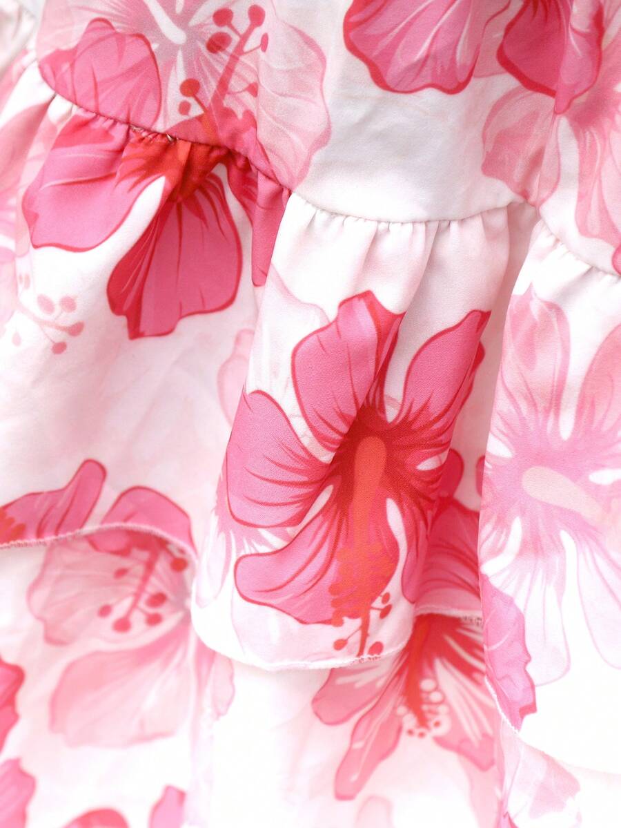 Light blue two-piece outfit set for tween girls with a sleeveless round neck vest top and a tiered ruffle cake skirt featuring a plant pattern.