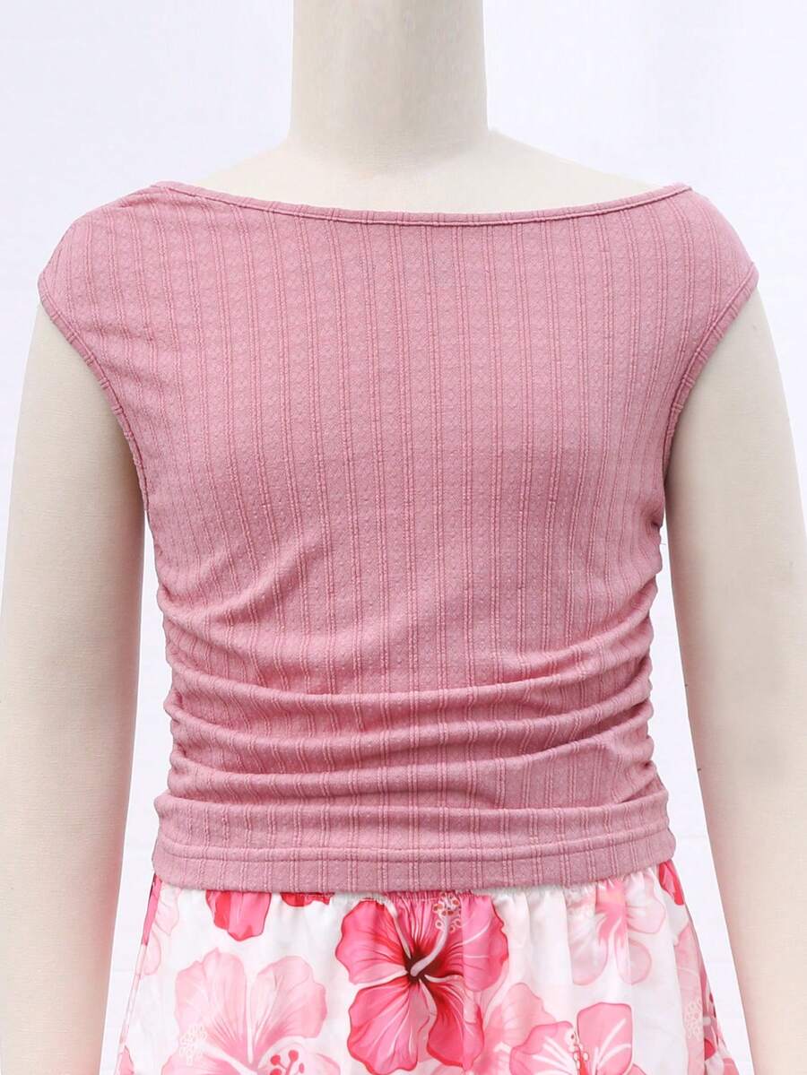 Light blue two-piece outfit set for tween girls with a sleeveless round neck vest top and a tiered ruffle cake skirt featuring a plant pattern.