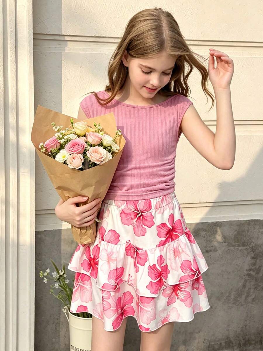 Light blue two-piece outfit set for tween girls with a sleeveless round neck vest top and a tiered ruffle cake skirt featuring a plant pattern.