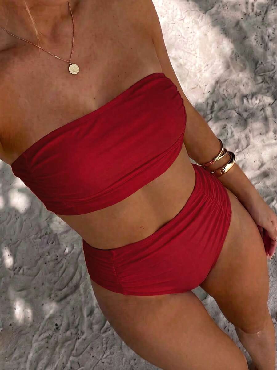 Women's black strapless ruched bandeau bikini top with high waisted bottoms