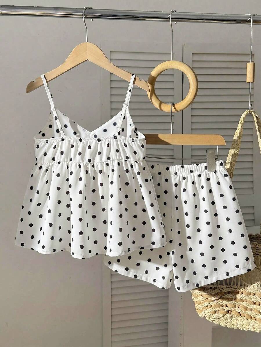 Tween girl 2-piece summer set with a black and white sleeveless striped spaghetti strap tank top with ruffle details and matching casual shorts.