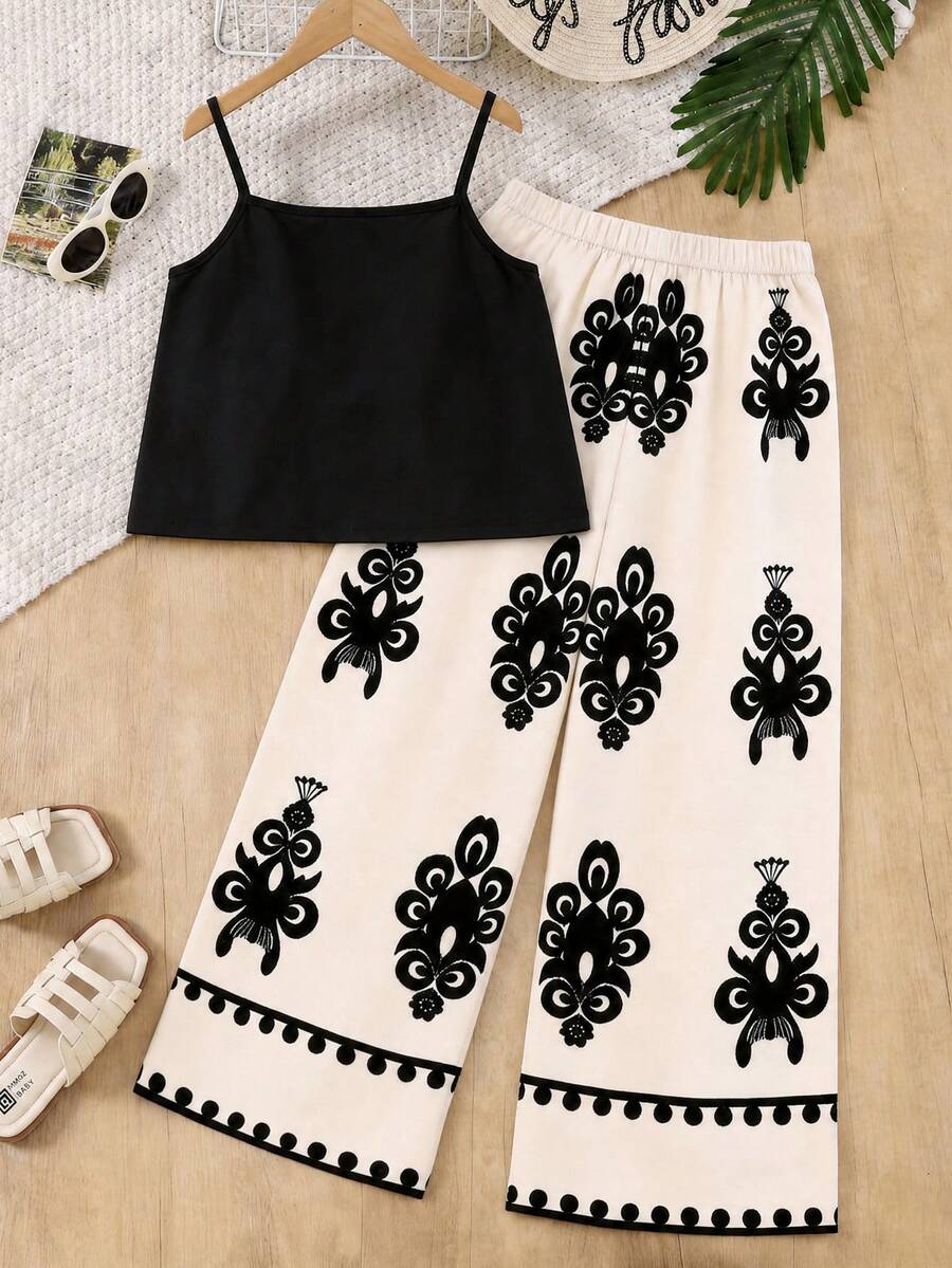 Tween girls blue 2-piece vacation outfit set featuring a tiered ruffle spaghetti strap camisole and loose high-waist pants.