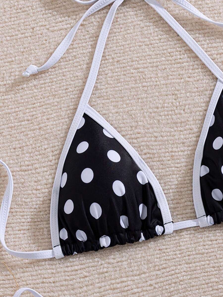 Women's two-piece halter triangle bikini set featuring a backless tie-back top with removable padding and matching tie-side mid-waist bottoms.
