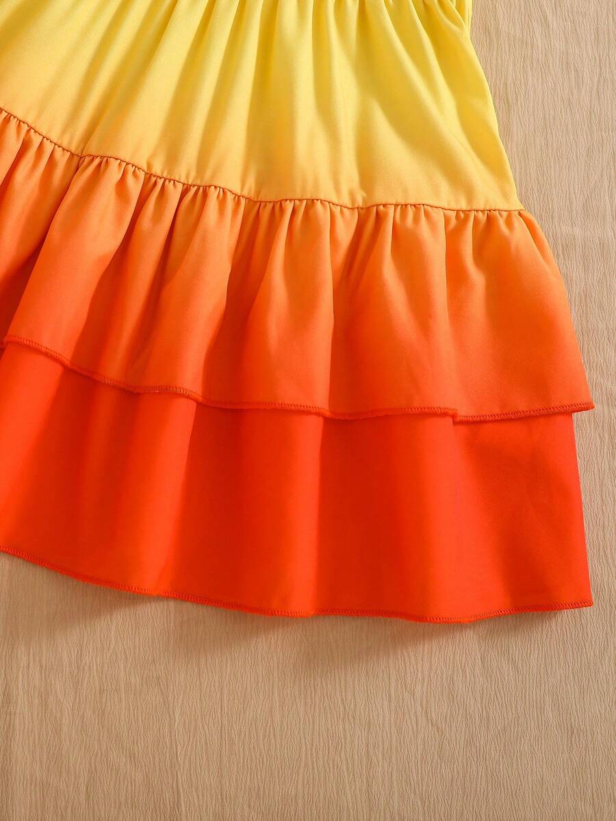 Light blue two-piece outfit set for tween girls with a sleeveless round neck vest top and a tiered ruffle cake skirt featuring a plant pattern.
